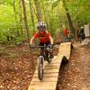 A young rider with MORE's sMORE's kids program dropping in on Boss Trail.