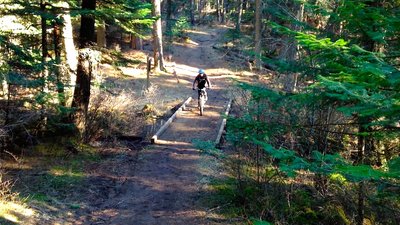 Rolling across a foot bridge on the English Point - Yellow Loop