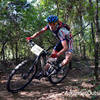 Cat 1 racer taking a turn at speed along the trail.