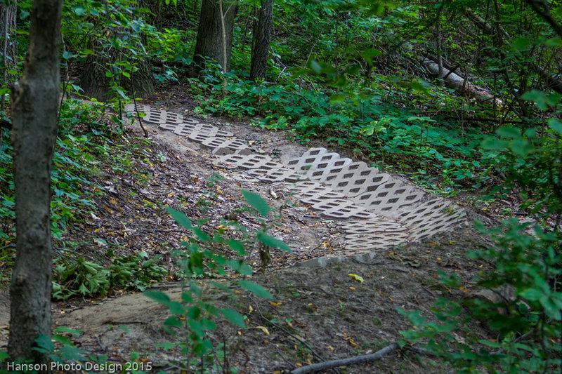 Turfstone pavers armoring a steeper section with berm of the North Loop decent trail.