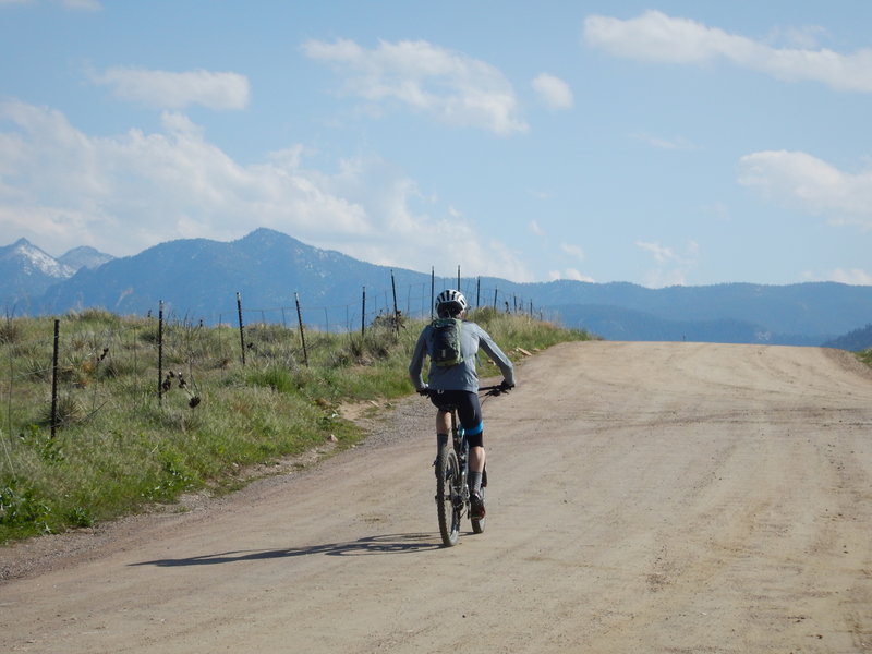 Bikers use the road section here for the Eagle Trail, not the singletrack inside the fence line