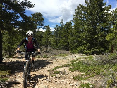 Ascending some Yellow Dot good-ness with the Indian Peaks in the background.