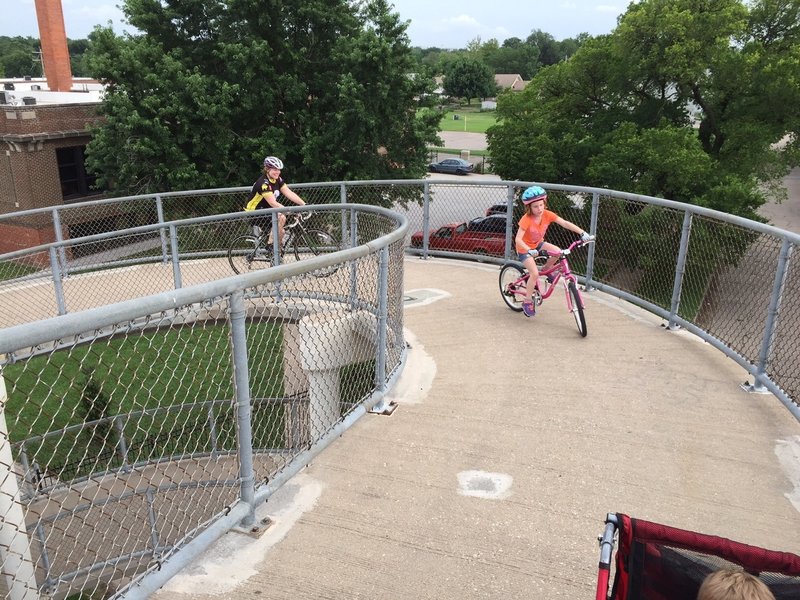 The pedestrian bridge has a spiral on each end that's fun to ride up!