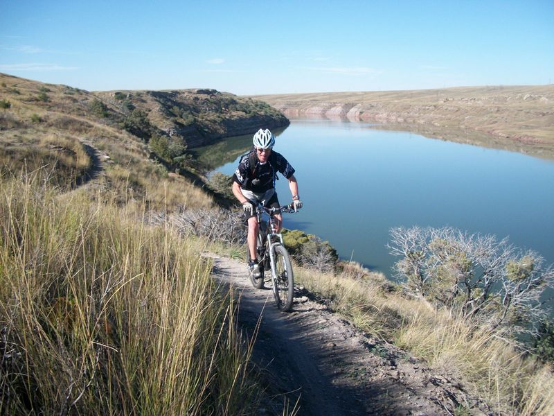 Shredding singletrack along Cochrane Reservoir.