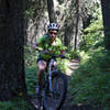 Riding the smooth portion of the trail in the dense, cool forest