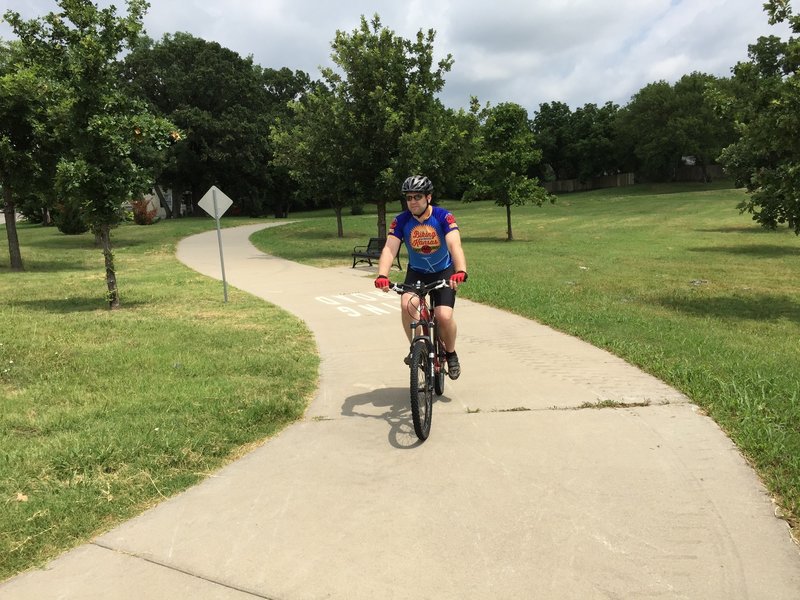 Just another paved path...ho hum...we're working with the city to make some dirt trails, honest!!