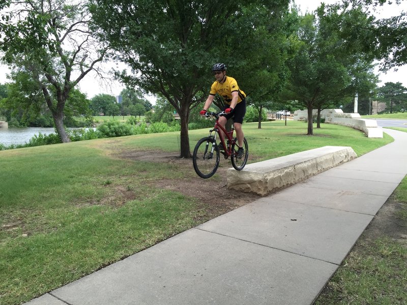 One of the cut rocks that are fun to jump!  They're only 12-15" high, so it's a good place to start.