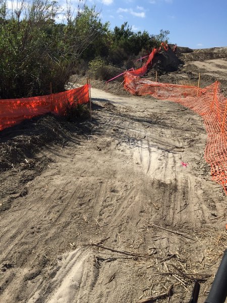 Open trail along side a development/construction fence