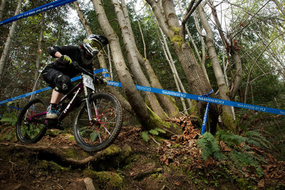 Lisa Muggli riding the root drop with poise.