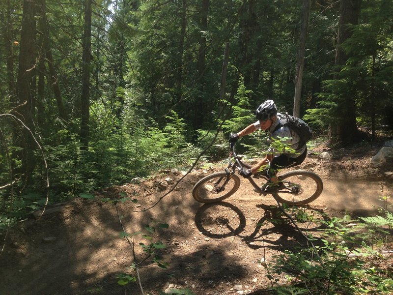 Riding through a smooth bermed corner on Lower Basin DH