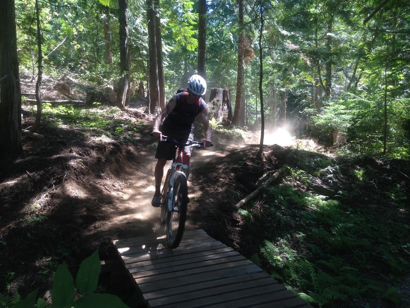 Riding over a bridge on Lower Basin XC