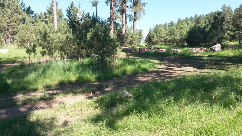 Parking area at the start of trail.   Travel through the boulders to start your ride.