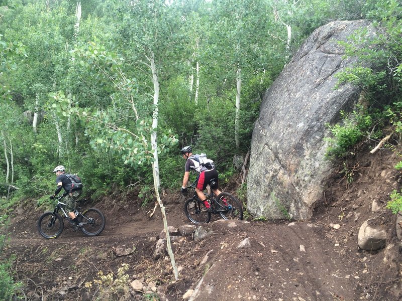 Riding by the big boulder along the Hummingbird Trail.