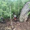 Riding by the big boulder along the Hummingbird Trail.