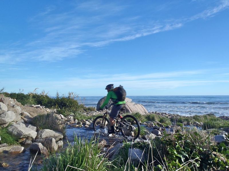 Riding a creek on the coastal section of track