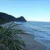 Early morning light on the sea looking back to Kohaihai Bluff at the south end of the Heaphy Track