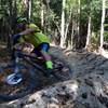 Steve, a near by law officer, "SPEEDS" around the new berm. This is fun addition to a fast and technical downhill section.