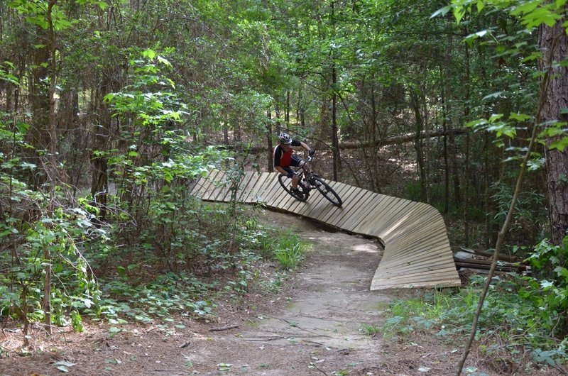 Johnny shows off his good form on one of the wooden berms.