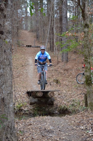 Johnny is about to sail over the creek jump. It's a 10' flight that is so much fun.