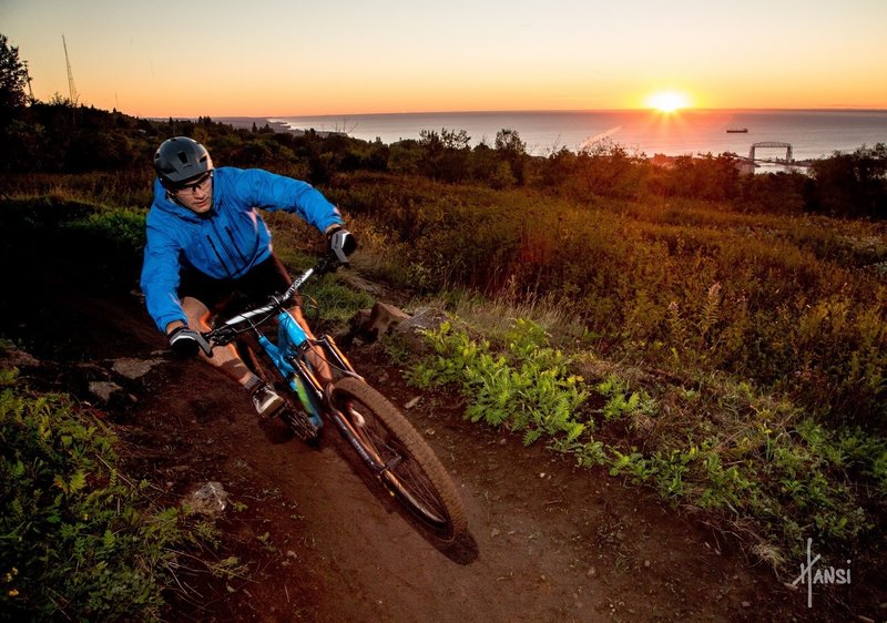 Photo credit: Hansi Johnson.
<br>
Ripping down the Observation Hill trail at sunrise.