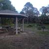 Picnic tables, baroque grill at the trailhead.