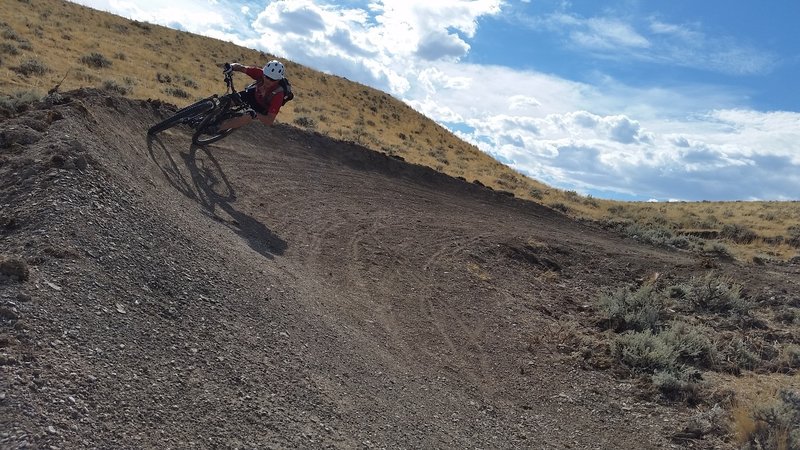 The berms are large and tread is super buff. Anybody can ride this trail, but few can ride it full tilt.