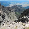 The plunging escarpment off Bristol Head (12706'). The road to Creede, Colo., is in the distance.