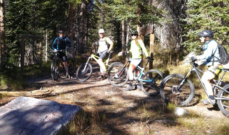 Riders pause at junction of Tipple Trail and French Creek Trail.