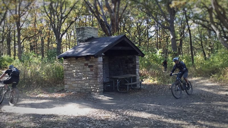 Jason O'Young, Mark Morgan, and Rick Nestor pass by the old CCC shelter on Stonehouse.