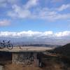 Cistern overlook where the fire road meets Camino Cielo. Trail continues to the right where the paved road turns to dirt again and is a steep hike-a-bike up.