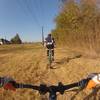 Ride along the powerlines for 200 yards until you come to the park benches on your right.  They signal the start of the singletrack section.