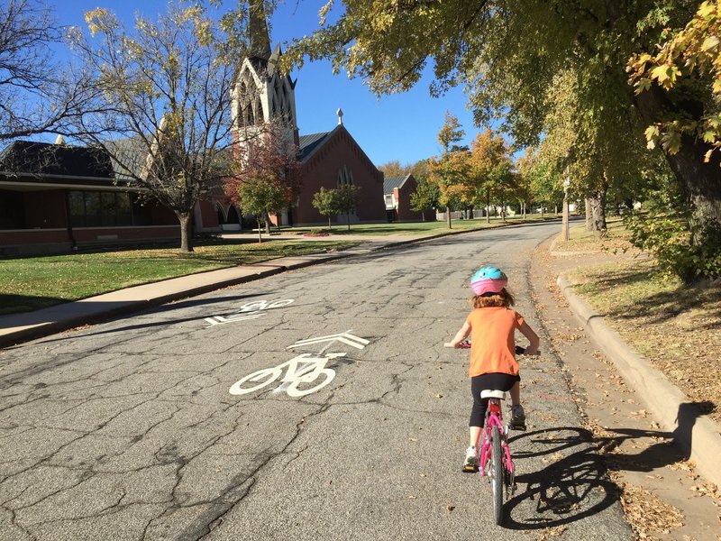 Riding past St. Thomas Aquinas School