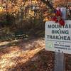 The trailhead is located at the Ross Hansen memorial park bench.