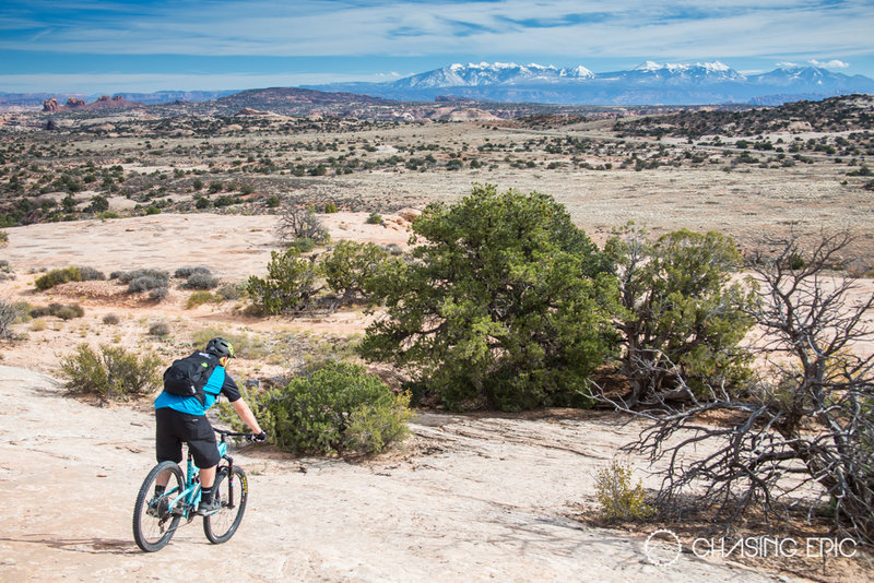Finishing up the ride on Navajo Rocks with the snow-covered La Sals in the distance.