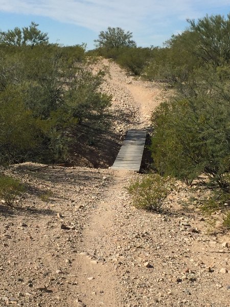 Narrow bridge with loose sounding boards. Looks harmless enough...