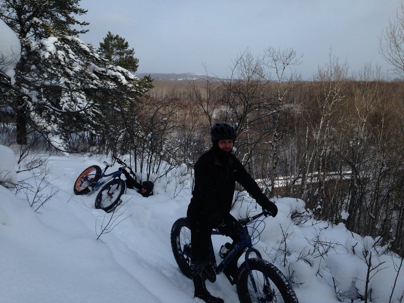 Deep snow makes for a soft fall off Amity West Trail.