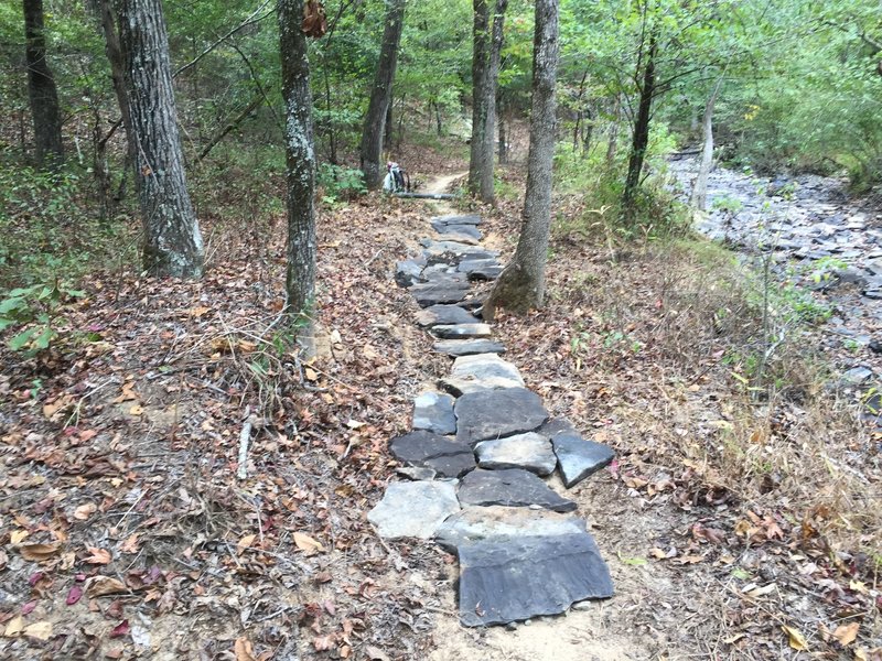 Trail armour using creek rock provides a unique riding experience.  This is one of the prettiest sections of the trail at mile 11 along the Northeast Loop.