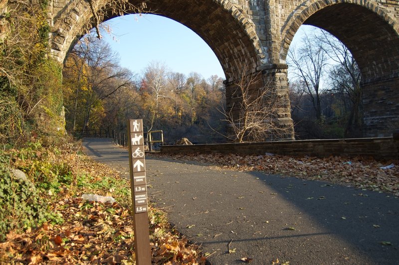 Enter on the multi-use paved path, which leads to Wissahickon trails.