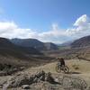 The trail down the west side of tsarmangchan La. The village of Hemis Shukpanchen in the background.