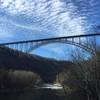 View of the New River Gorge Bridge from Fayette Station Road. If you head east (river right) from this point and climb up the road (against traffic) the trail will be on your left off of a gravel road.