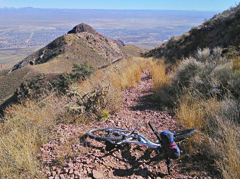 Steep descent with east El Paso in the background.