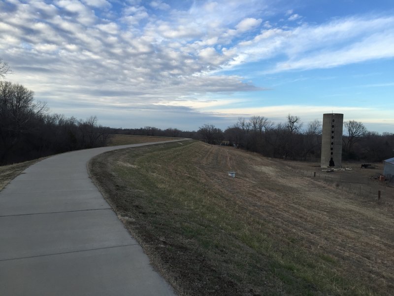 This is a path along the top of a river dike and will be the connection to the trail being built along the river in 2016.