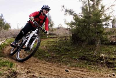 Enjoying the downhill on the spring dirt.