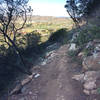 Lilac Miners Peak Loop overlooking out to 4s Ranch.  Narrow trail, but the lower half is so much fun!