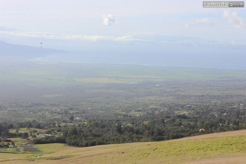 Paragliders, disc-golf course, lavender farm, and paved switchbacks between grassy fields.