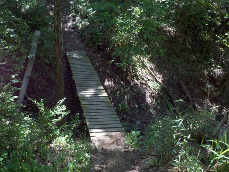 Narrow bridge across a deep wash and a punchy little climb at the end.