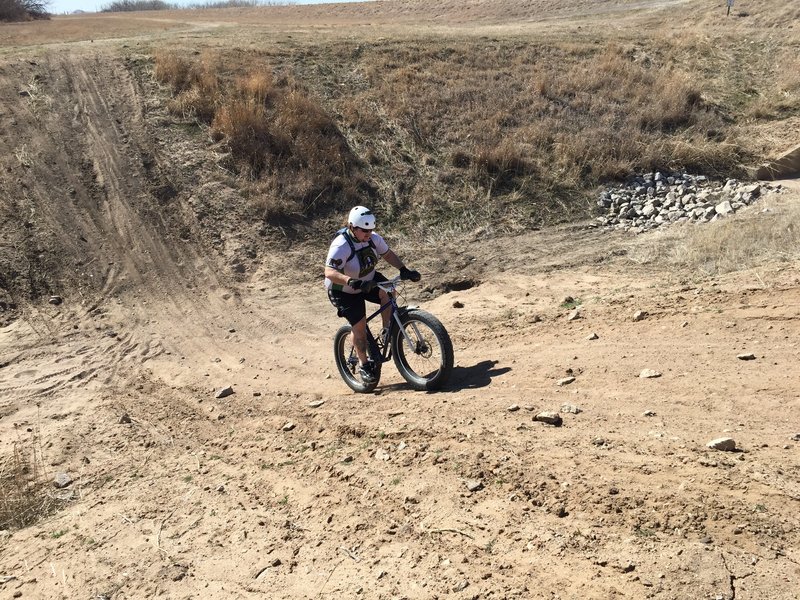 The entrance to the River Trail; a 20' deep ditch to practice your descent and climb skills in. There's a super smooth transition at the bottom, keep your momentum up, and you'll hardly have to pedal out!