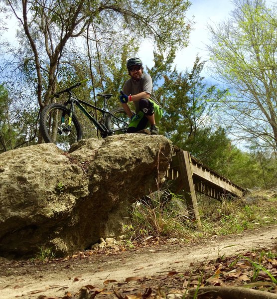 Great skinny that's wide but higher off the ground that transitions nicely to a 2-3 foot drop of the rock feature. Easy enough to do on the hardtail, but still fun and challenging!