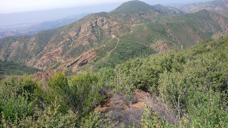 View from Santiago Truck Trail (looking west) of The Luge trailhead, with Orange County in the background.