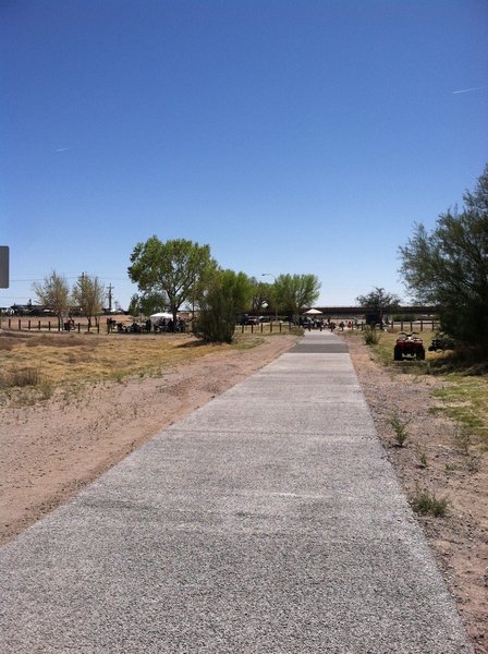 North side of this trail recently poured in concrete for the entire northern leg. The southern leg is asphalt with a crushed fine track running alongside it. this picture shows the Trailhead.